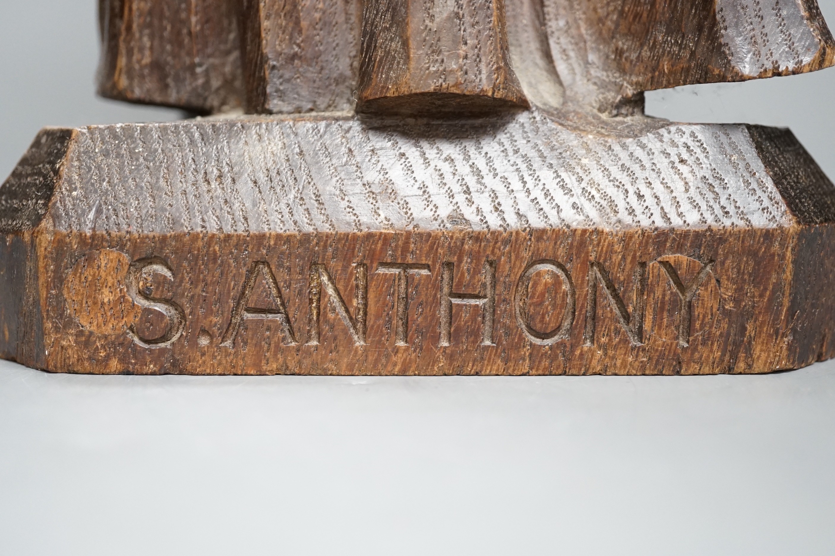 An early 20th century carved oak figure of St Anthony, 51cm